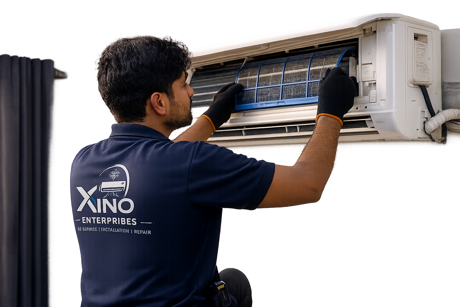 Technician servicing a wall mounted AC unit
